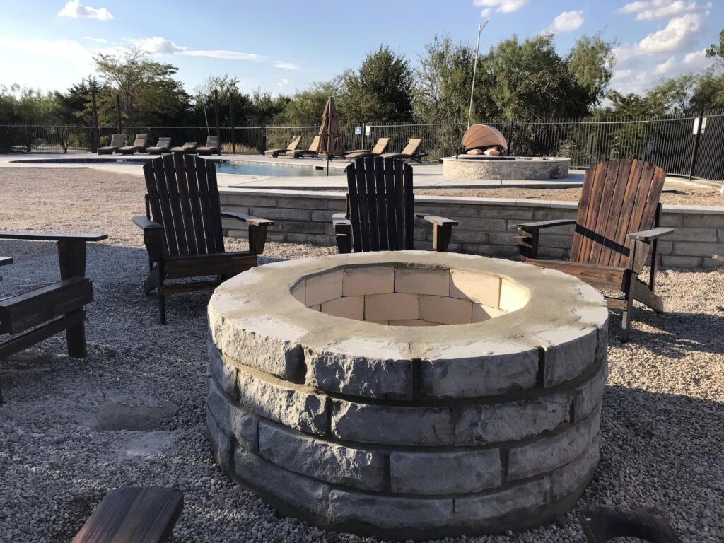 group firepit area in poolside area at batl ranch