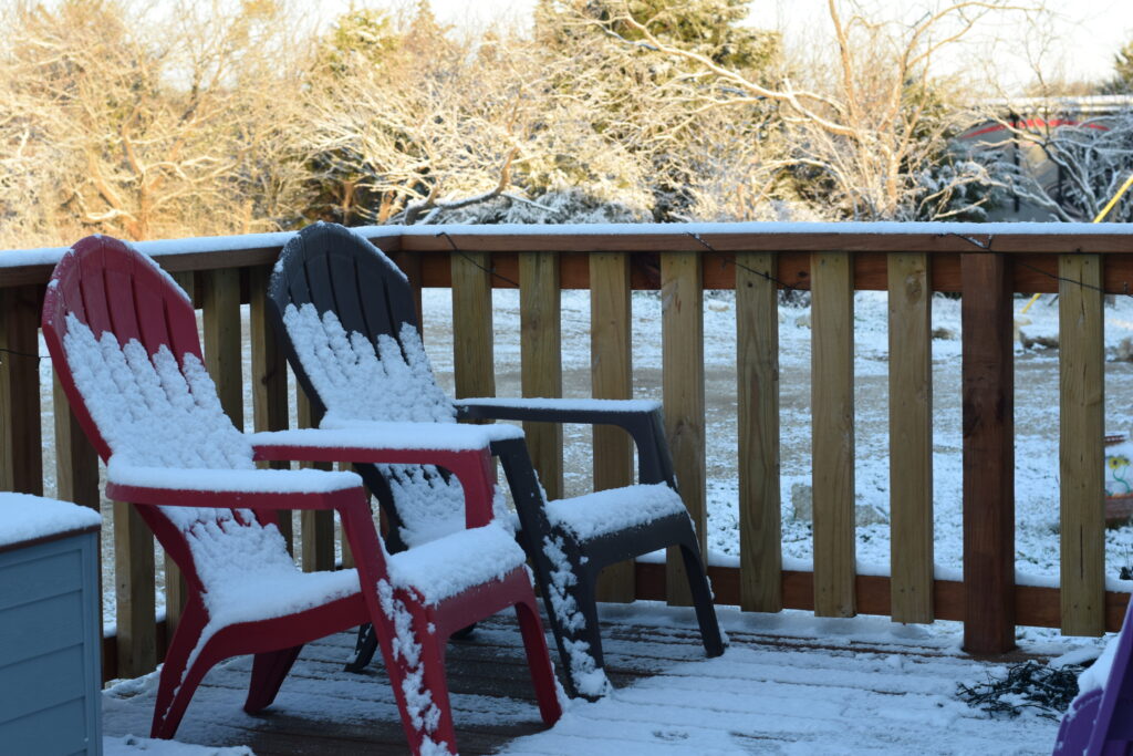 snowfall on porch in winter 2022