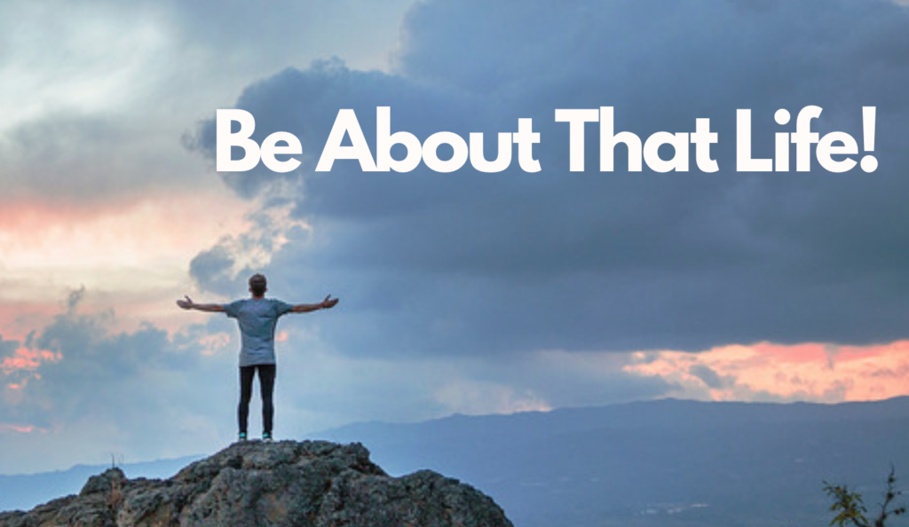 man standing on rock with arms out and words be about that life motto